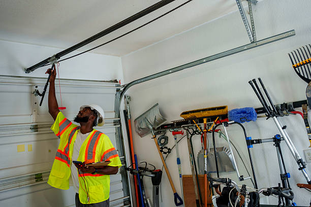 Professional Garage Door Panel Replacement technician working in Sand Point, AK